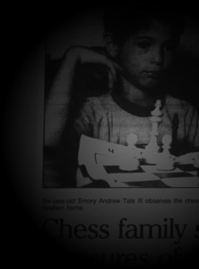 Newspaper clipping of a six-year-old Andrew Tate at a chessboard at the family home in Goshen, Indiana